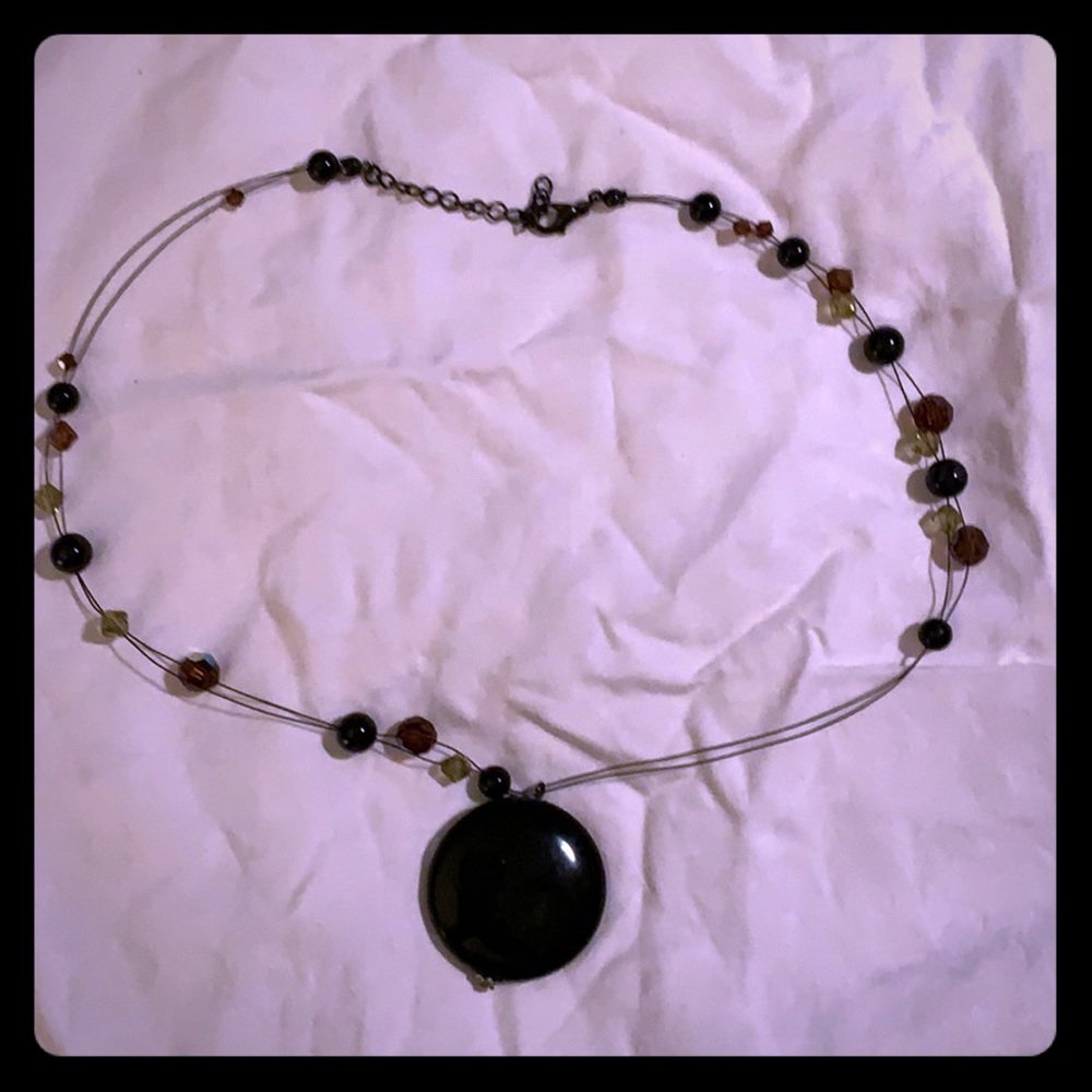 Black stone with light brown crystal glass